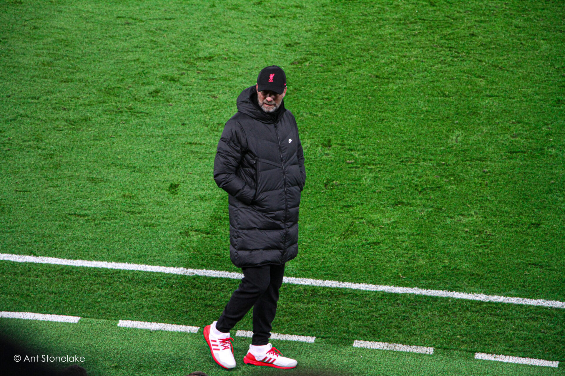 Jurgen Klopp assessing the Liverpool bench against Atletico Madrid