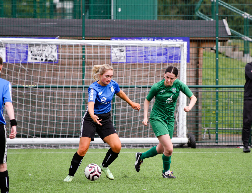 Bec Birchall looks to steal the ball