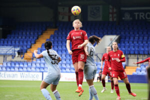 Liverpool's Rachel Furness winning a header against Aston Villa.