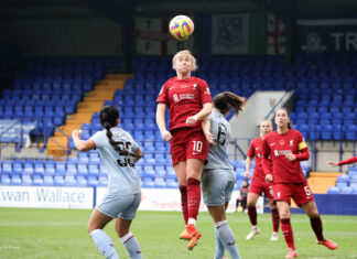 Liverpool's Rachel Furness winning a header against Aston Villa.
