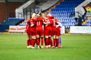 Liverpool Women huddled before facing West Ham United.
