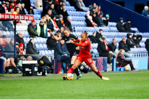 Taylor Hinds taking on West Ham's Lisa Evans.