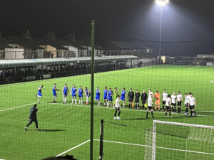 Marine and Stalybridge line up before kick off - pic by Jack Holmes