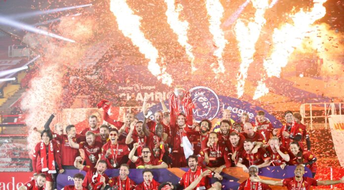 Liverpool players celebrate with the Premier League trophy