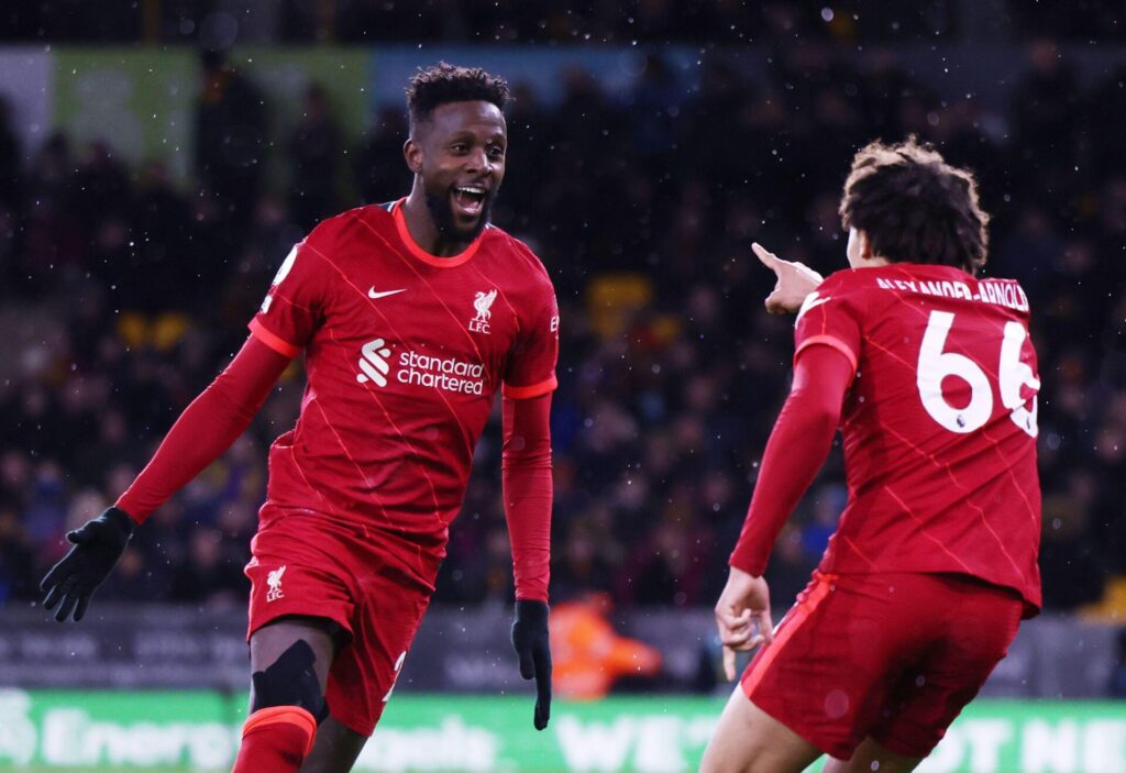 Divock Origi celebrates a goal with Trent Alexander-Arnold. Photo by Alamy images