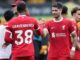 Ryan Gravenberch of Liverpool shakes hands with team mate Dominik Szoboszlai - FREE TO USE ALAMY LICENSE