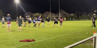People training on a rugby pitch