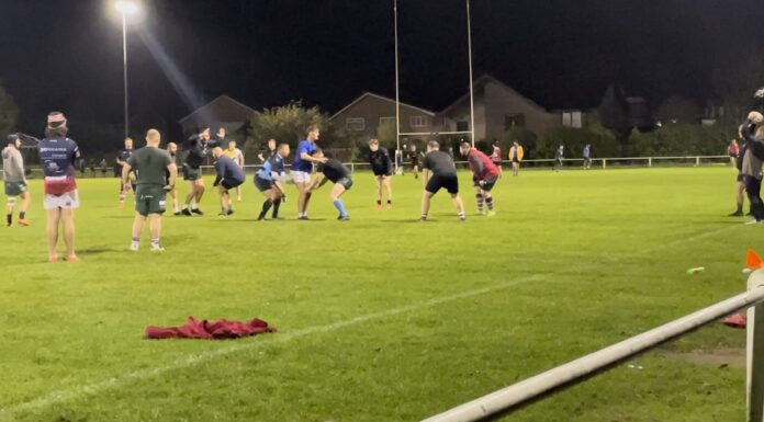 People training on a rugby pitch