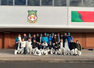 Cricket team outside The Racecourse Ground