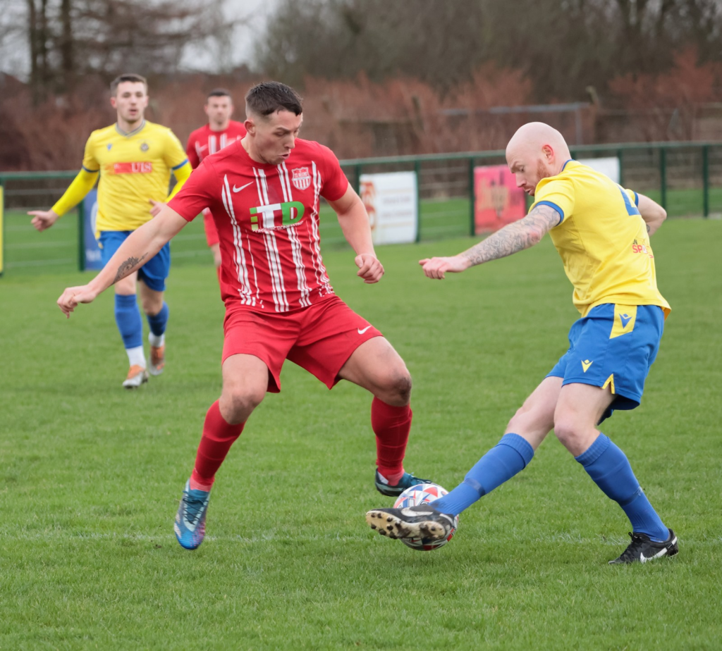 Joe Barker challenges for the ball - image by Mark Gambles