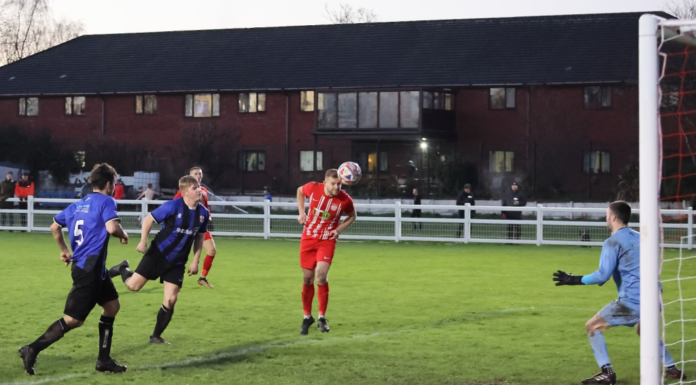 Josh Hall buries a header - image by Mark Gambles