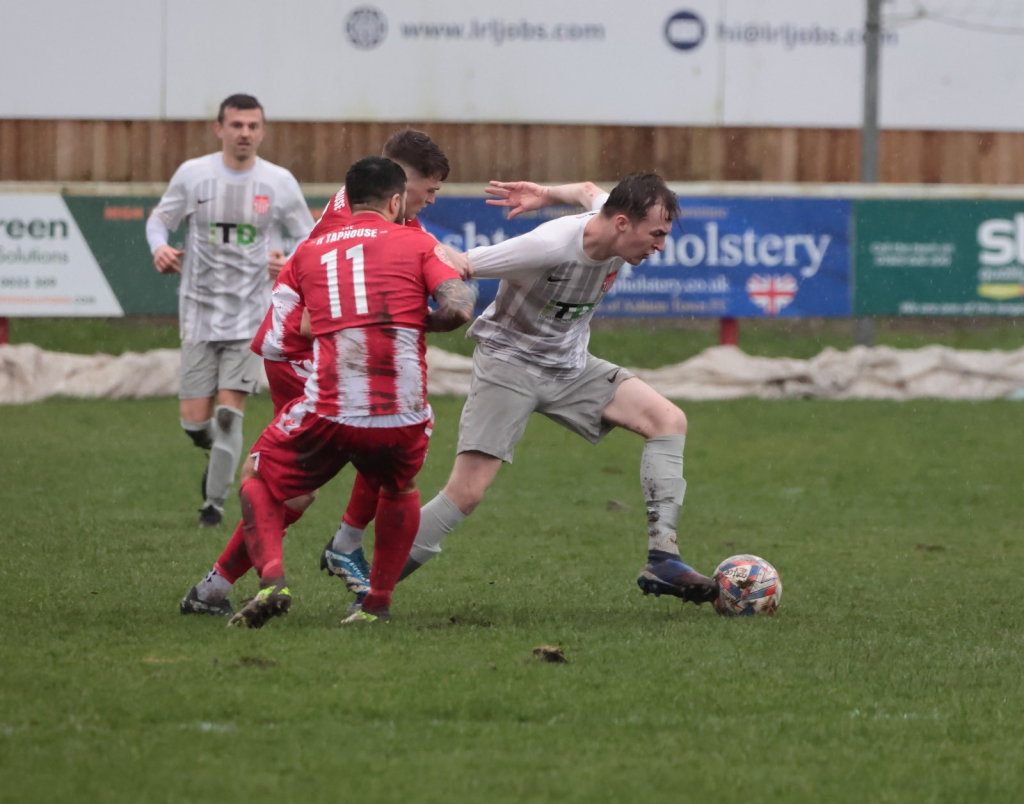 Kieran Curtis holds an opponent off, image by Mark Gambles