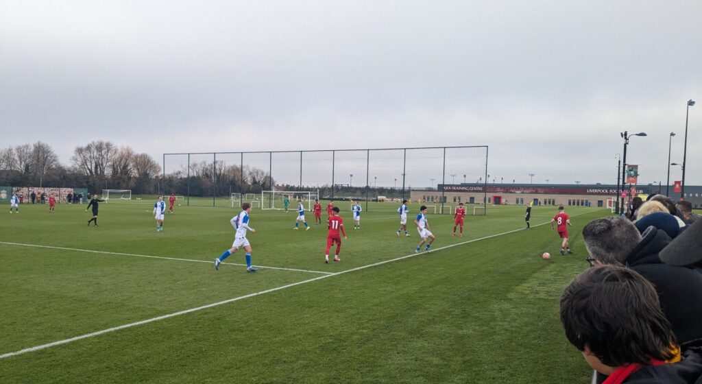 The crowd look on as Liverpool u18s take on Blackburn Rovers u18s at the AXA Training Centre
