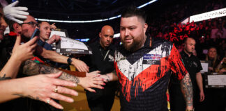 Michael Smith interacting with fans during his walkout at the premier league of darts - Owner (Kieran Cleeves/PDC)