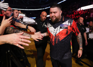Michael Smith interacting with fans during his walkout at the premier league of darts - Owner (Kieran Cleeves/PDC)