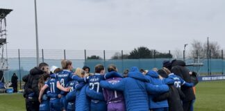 Brian Sorensen's Everton women huddled after Chelsea defeat.