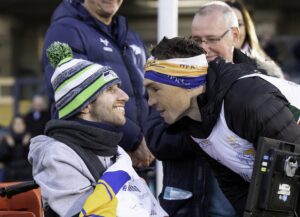 Picture by Allan McKenzie/SWpix.com - 23/11/2021 - Rugby League - Kevin Sinfield Extra Mile Challenge - Mattioli Woods Welford Road to Headingley Rugby Ground, England - Kevin Sinfield (r) meets Rob Burrow at the finish line after completing his Extra Mile Challenge of 101 miles in 24 hours.