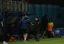 Brian Sorensen shakes hands with the Manchester United bench after a 2-0 loss. Pic by Matty McClennon.