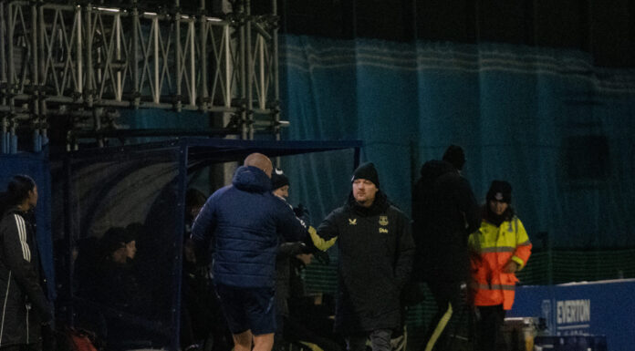 Brian Sorensen shakes hands with the Manchester United bench after a 2-0 loss. Pic by Matty McClennon.