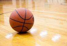 Basketball on hard wood court