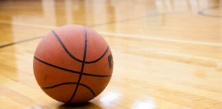 Basketball on hard wood court