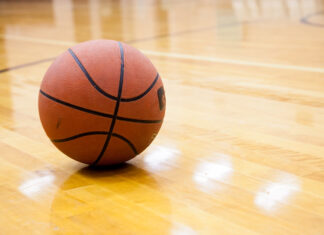 Basketball on hard wood court