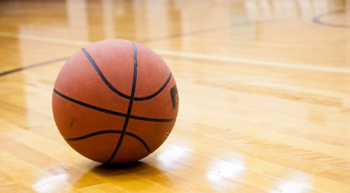 Basketball on hard wood court