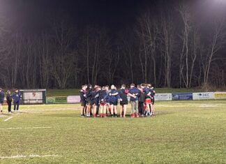 Birkenhead Park players in a huddle