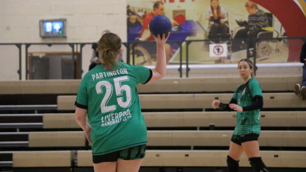 Handball player throwing a ball in match