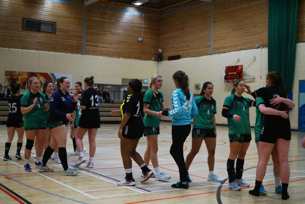 Liverpool Handball and NEM Hawks Women shake hands