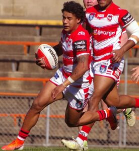 Tristan Sailor carries the ball