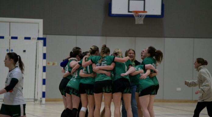 Liverpool Handball Club women's team celebrating after a hard fought win