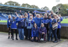 A group of female Bury FC fans inside Gigg Lane including Zoe Hitchen