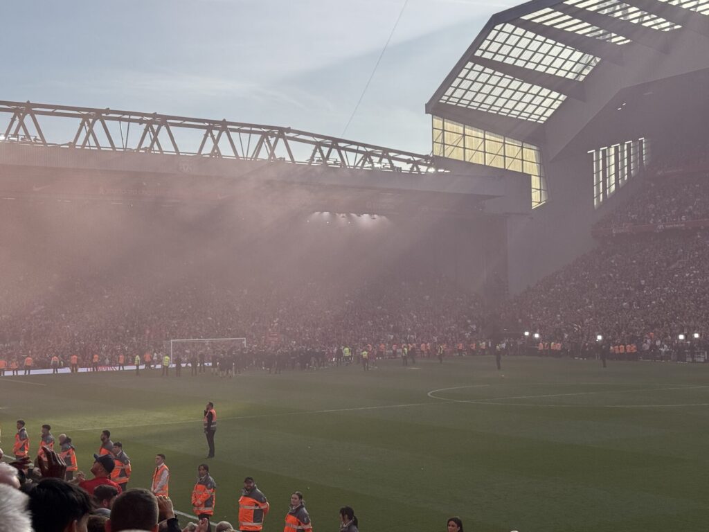 Liverpool players and staff celebrate infrot of the Kop after winning the Premier League by Daniel Moffat
