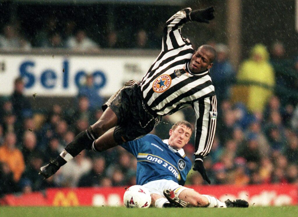 Tony Grant tackles Faustino Asprilla