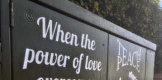 Image of a power-box in Toxteth displaying an uplifting message promoting inclusivity. Pic by Aled James
