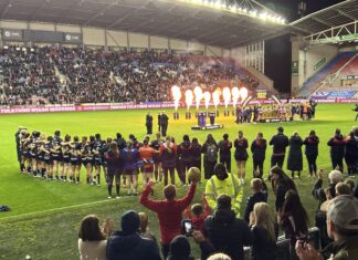 St Helens watch on as Wigan lift trophy / Dylan Jones