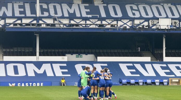 Everton Women pre-match huddle against Tottenham Hotspur Women. Image taken by Sienna Hughes.