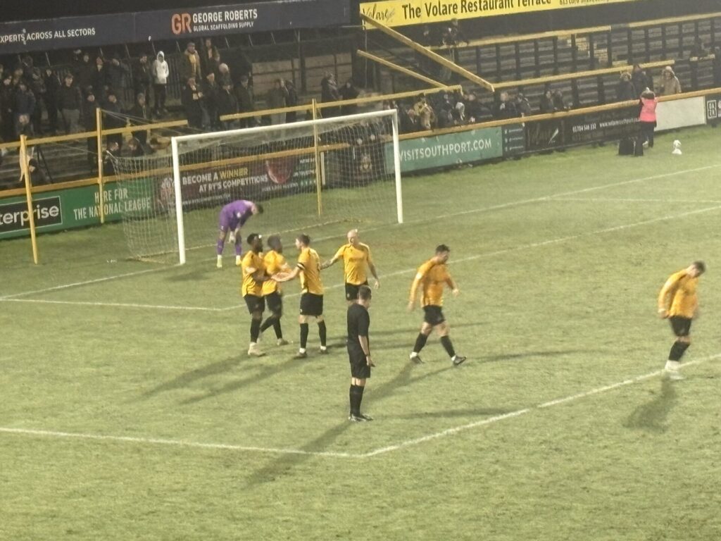 The team celebrating Jordan Slew's goal that opened the foodgates for Southport. Photo by Rayhan Bengougou