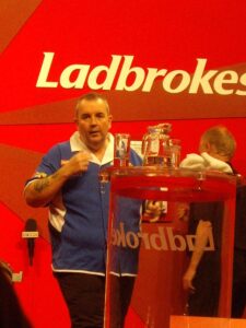 Phil Taylor at the Darts World Championship / image from sachab Wikimedia Commons