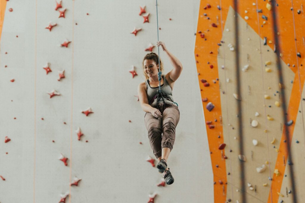 Picture of women climbing from Unspash. Photo by roya ann miller on Unsplash