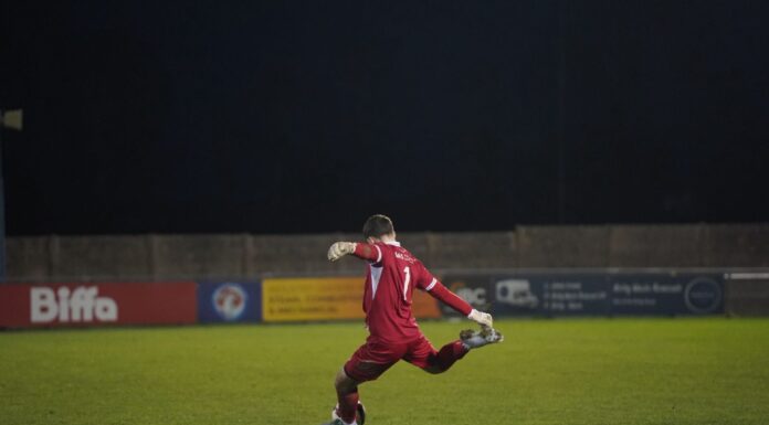 Free-scoring Vauxhall Motors too much for Darlaston Town FC Motors number one Reece Trueman takes a free kick. Image by Hollie McCulloch
