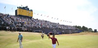 SOUTHPORT, ENGLAND - JULY 17: Lucas Herbert of Australia acknowledges the crowd on the 18th green following his round of 62 (-8), equaling the record of the lowest round in men's major history during Day Two of the The 154th Open Championship at Royal Birkdale on July 17, 2026 in Southport, England.